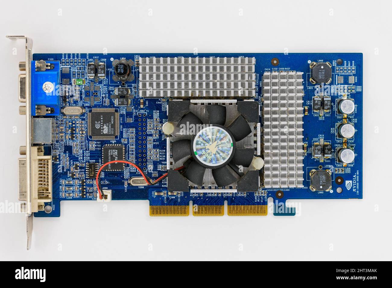 Printed circuit board of an NVidia computer video card, showing the heat sinks and fan. Stock Photo