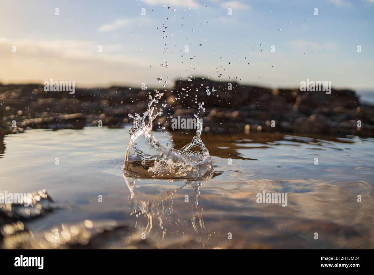 Macro shot of the water splash in the rock pool Stock Photo - Alamy
