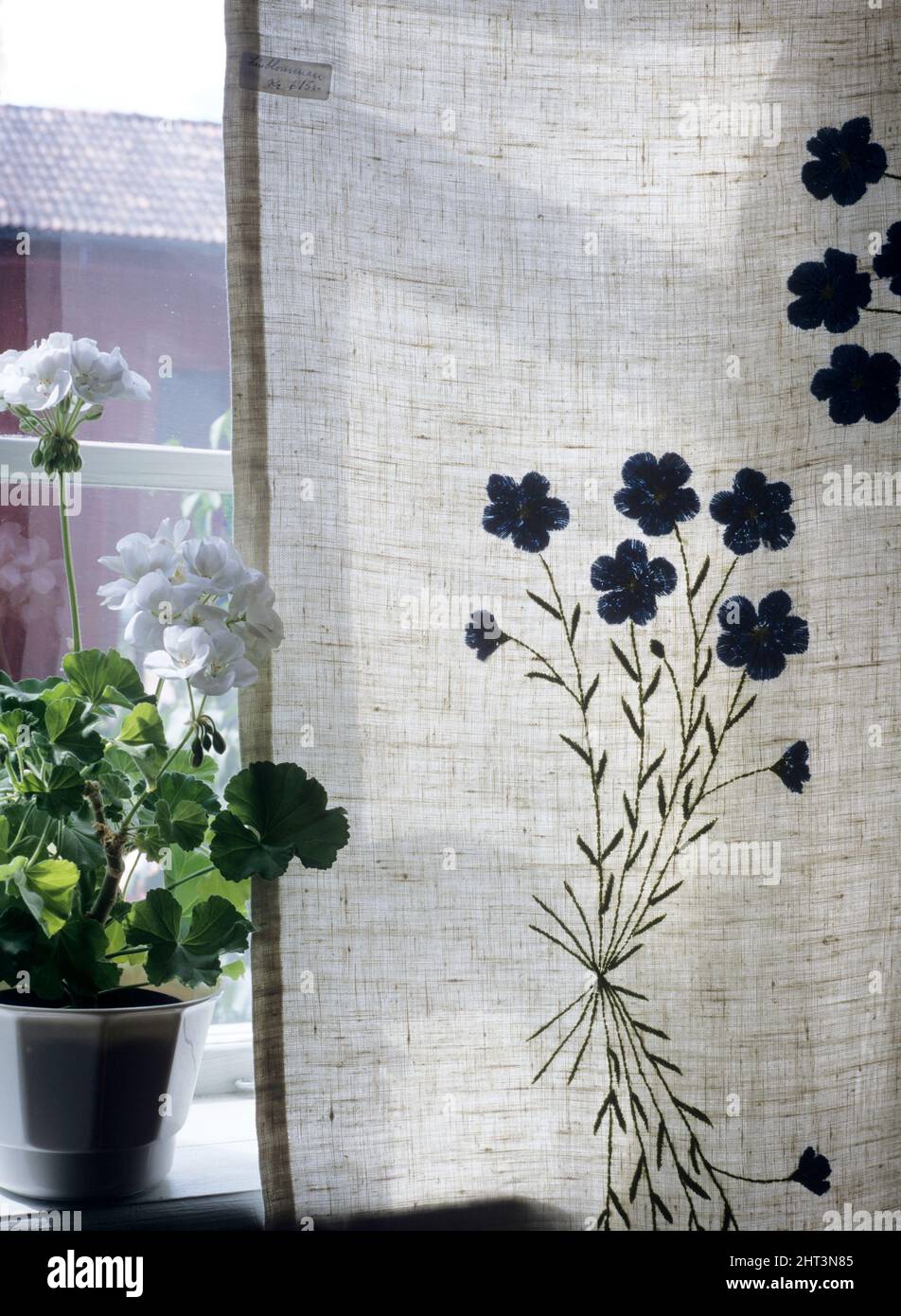 Linen curtain with linen flower Stock Photo