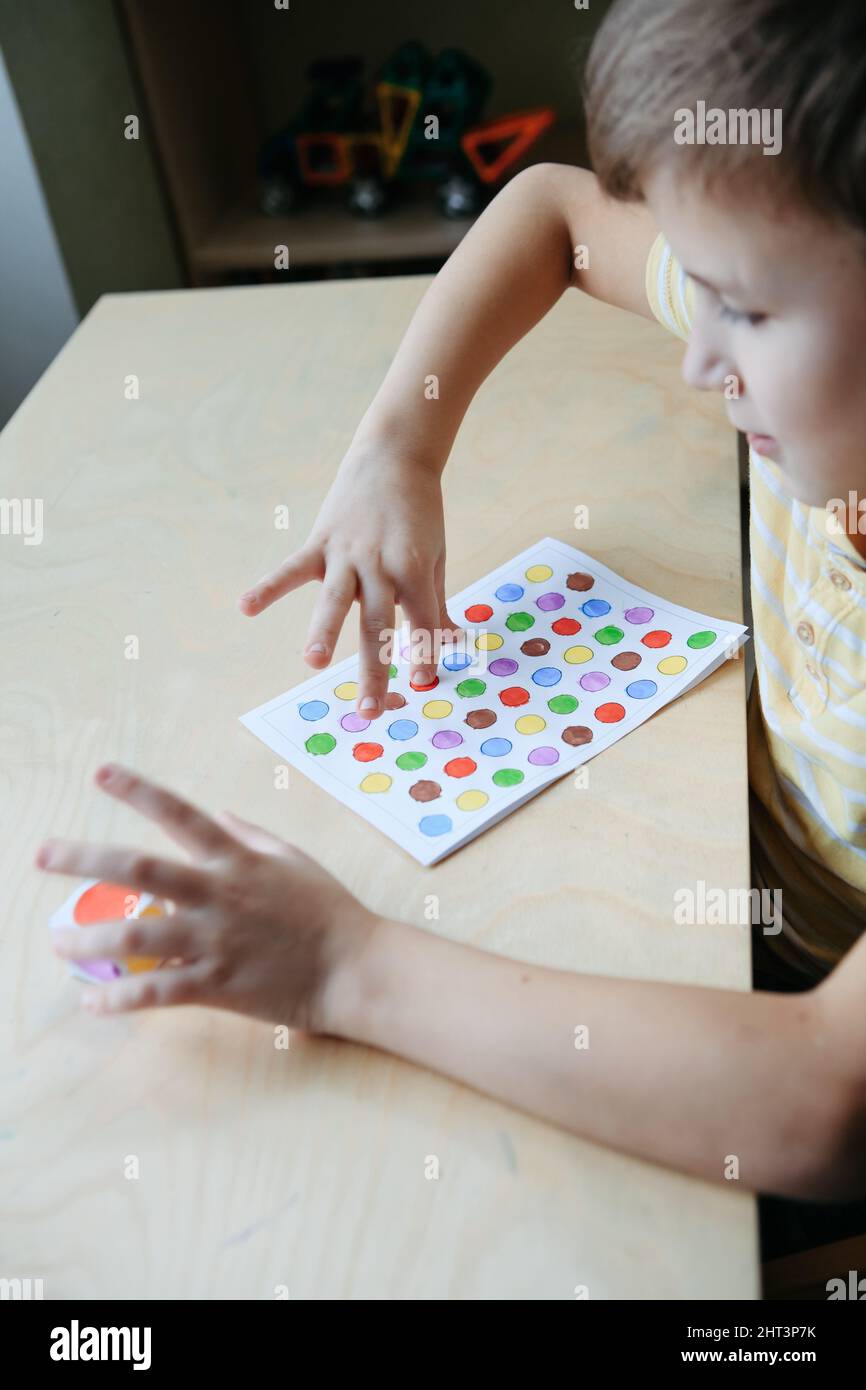 Child playing diy dot game for fingers Stock Photo Alamy