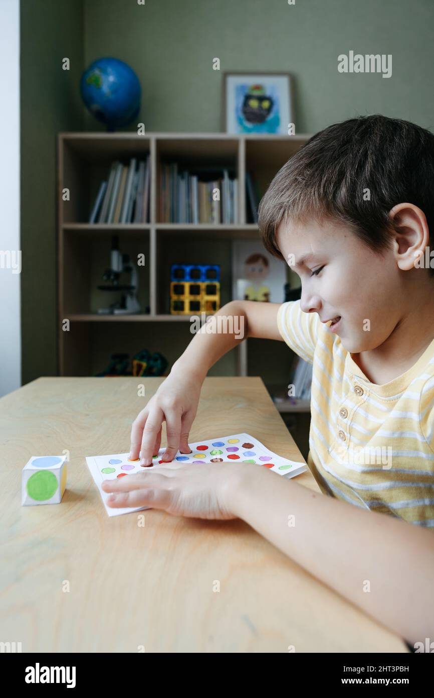 Child playing diy dot game for fingers Stock Photo Alamy