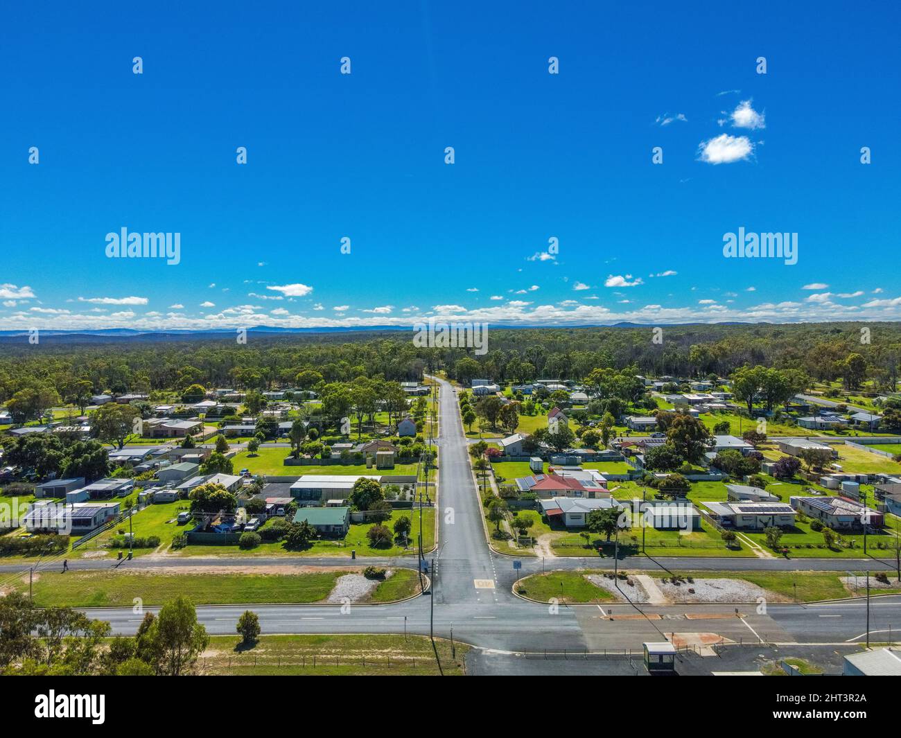 Aerial View of the town of Gilgai surrounded by green rainforests in