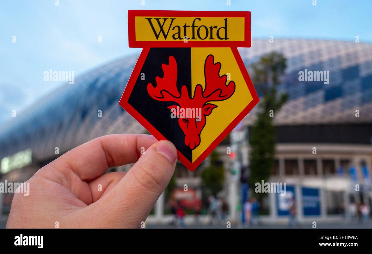 September 12, 2021, Moscow, Russia. The emblem of the Watford Football Club against the backdrop of a modern stadium. Stock Photo