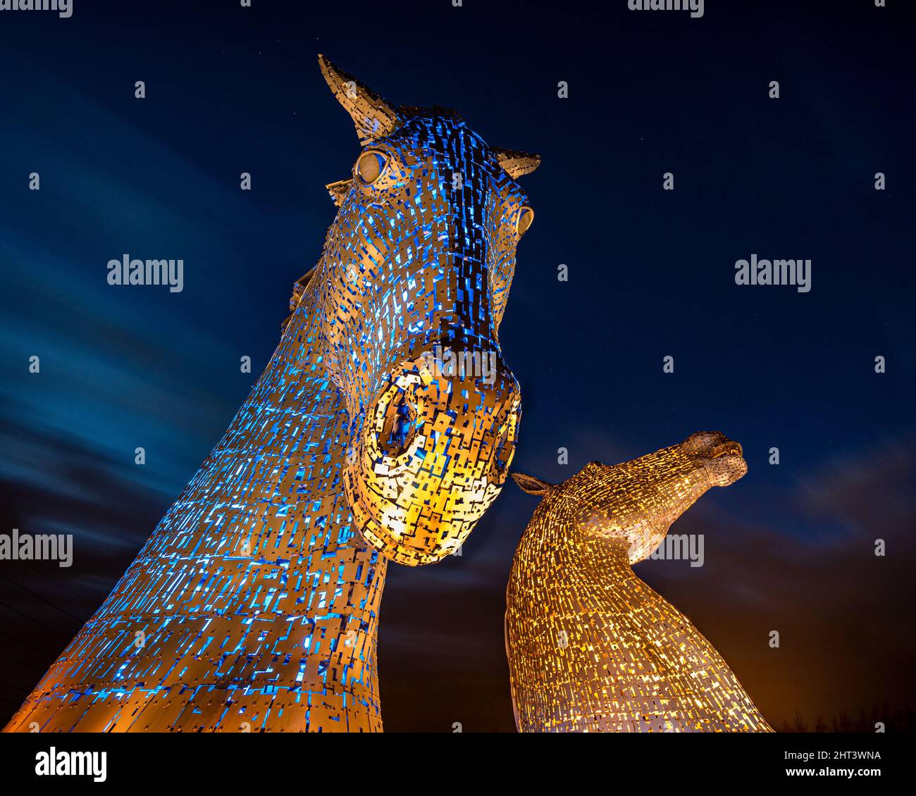 As part of the global show of solidarity for the people of Ukraine The Kelpies, have been lit up blue and yellow. Stock Photo