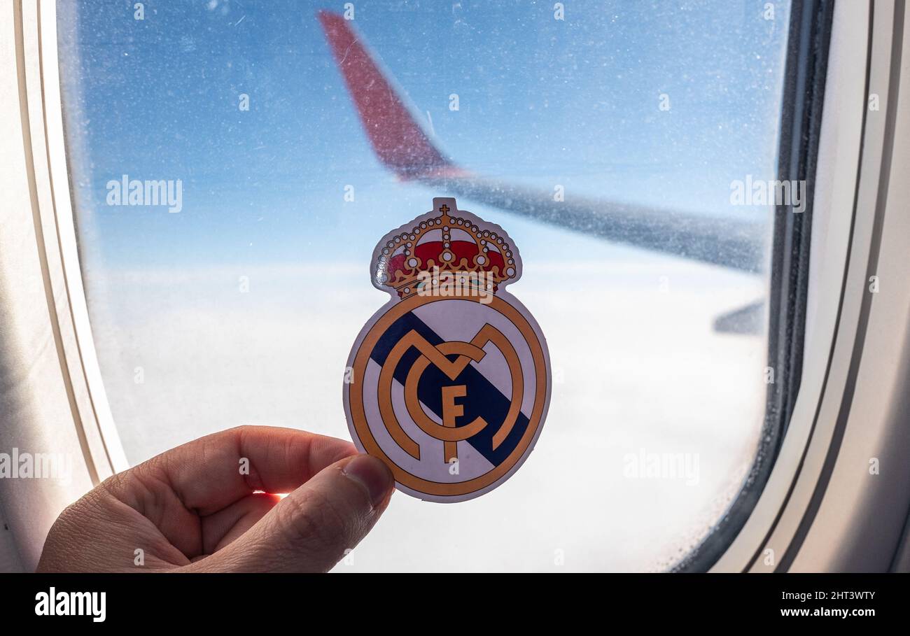 December 6, 2021. Madrid, Spain. The emblem of the Real Madrid CF football club on the background of the airplane window. Stock Photo