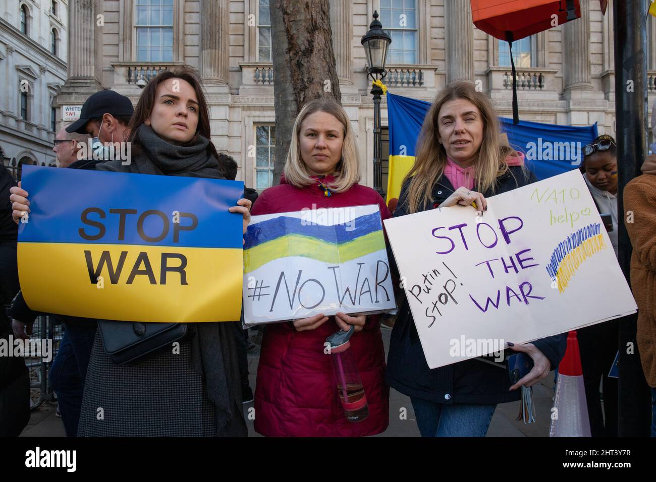 London, England, UK 26 February 2022 Thousands gather outside Downing Street in solidarity with Ukraine to protest against Russia’s invasion of the country. Men, women, children of all nationalities stand beside Ukrainians and Russians opposing President Vladimir Putins war. Stock Photo