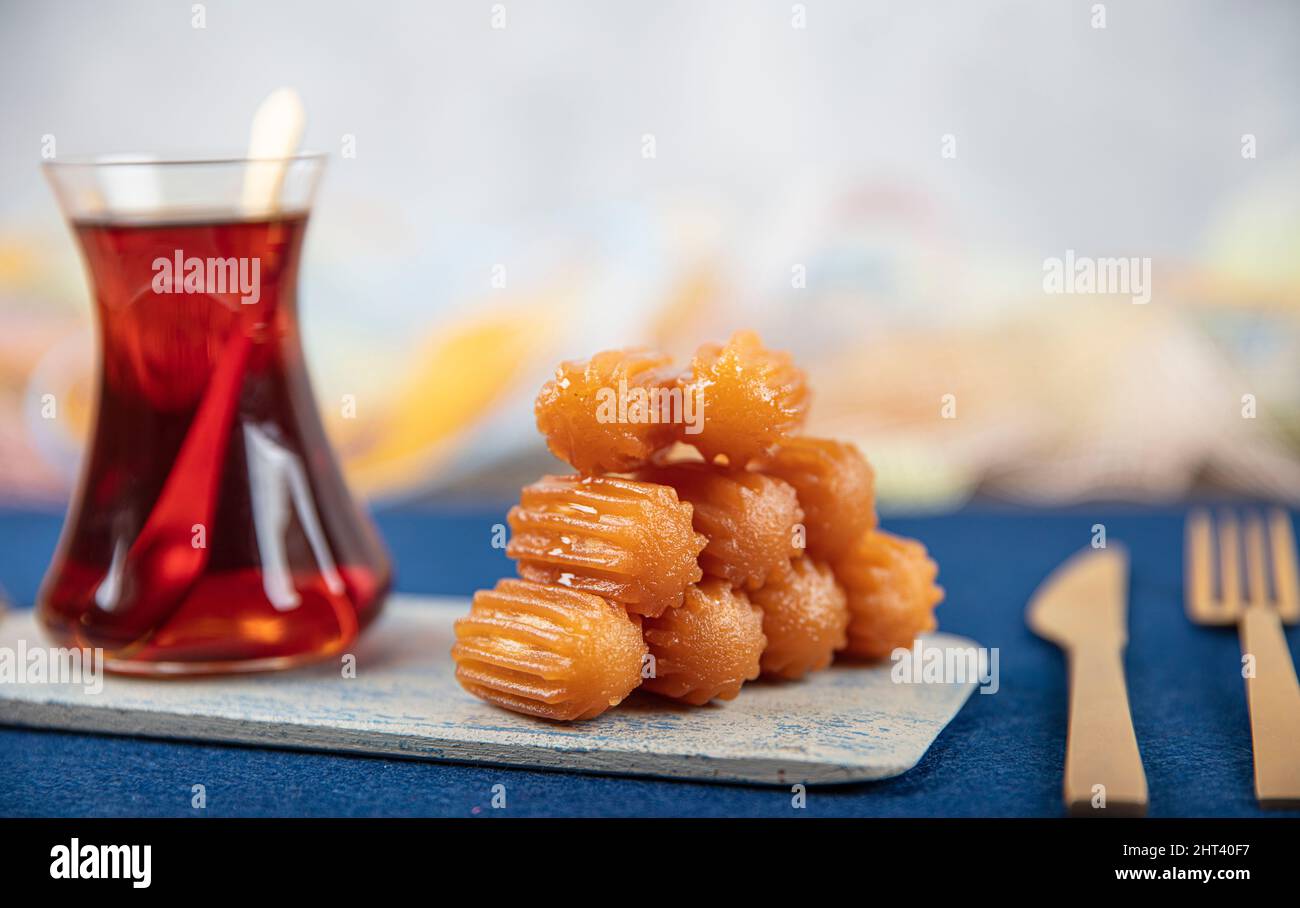 Traditional Turkish dessert tulumba, tulumba tatlisi in a plate served