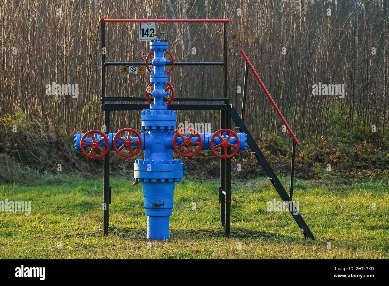 Blue fountain fittings with red valves in a gas well Stock Photo