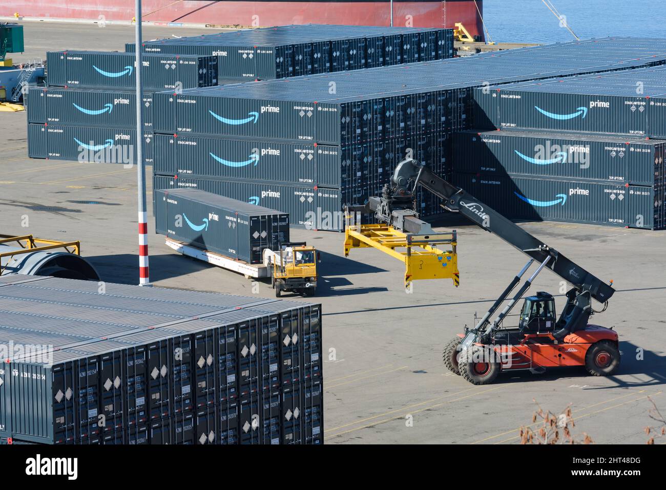 Everett, WA, USA - February 25, 2022; Stacking operation of Amazon Prime intermodal shipping containers at Port of Everet Stock Photo
