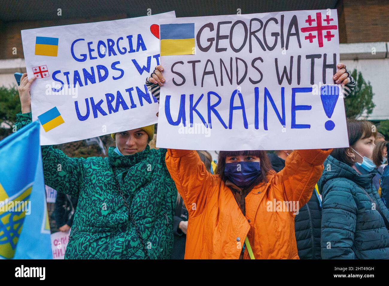 Madrid, Spain. 26th Feb, 2022. Ukrainian supporters hold placards that say “Georgia Stands with Ukraine “ outside the Russian embassy as they take part in an anti-war rally, on the fourth day after Russia attacked Ukraine territory.Anti-war protests in support of Ukraine are taking place in the world's largest cities (Photo by Atilano garcia/SOPA Images/Sipa USA) Credit: Sipa USA/Alamy Live News Stock Photo