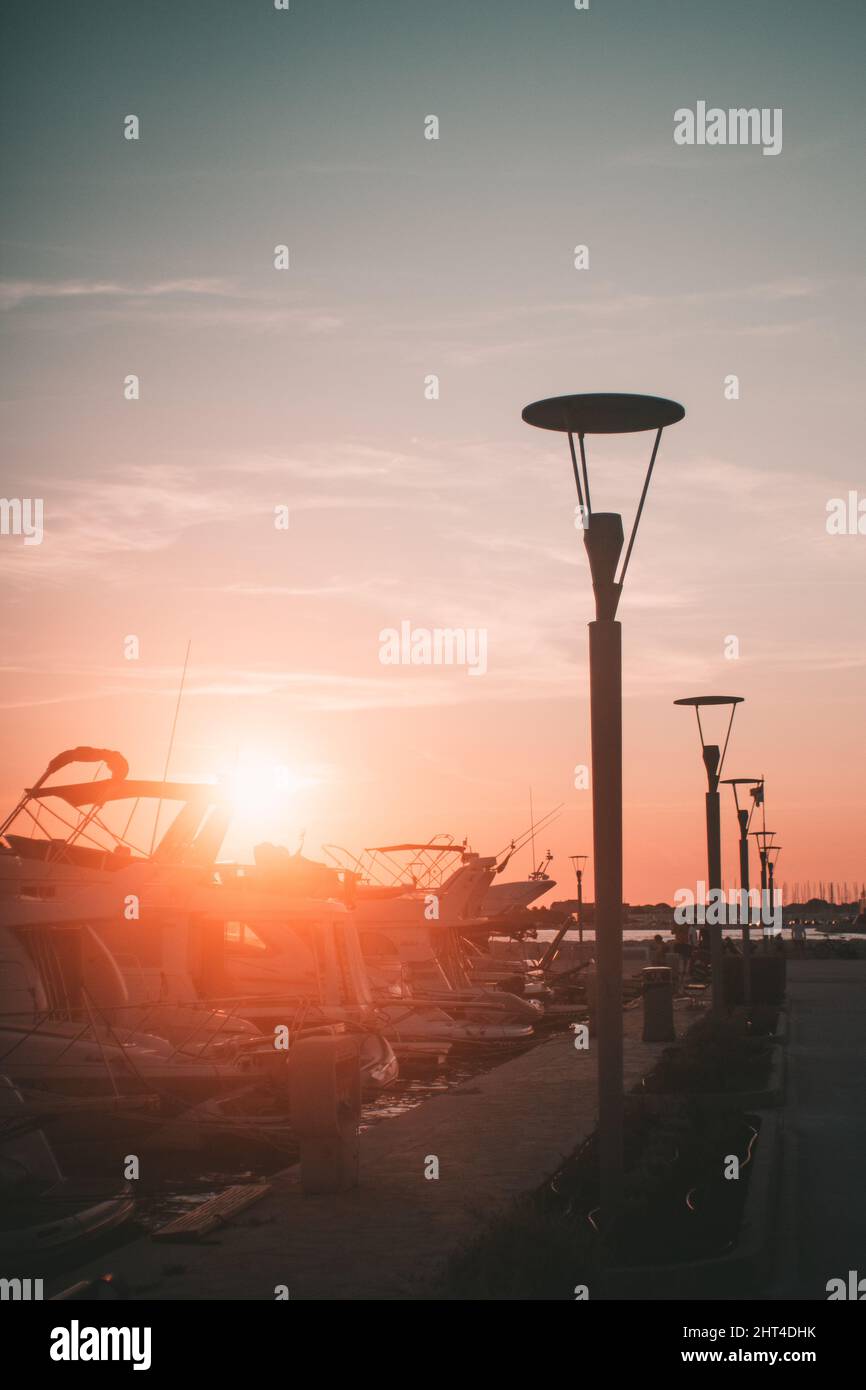 Vertical shot of street lights at susnet Stock Photo - Alamy