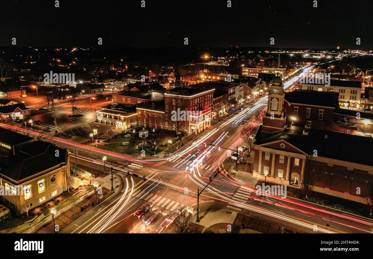 Aerial view of a beautiful city at nighttime with lights shining on the ...