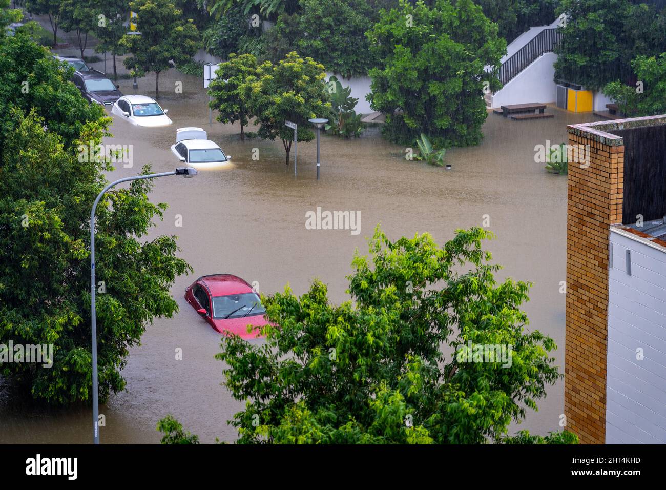 Brisbane, Australia - Feb 27, 2022: Roads flooded and car under water after the heavy rain in West End suburb, flood Stock Photo