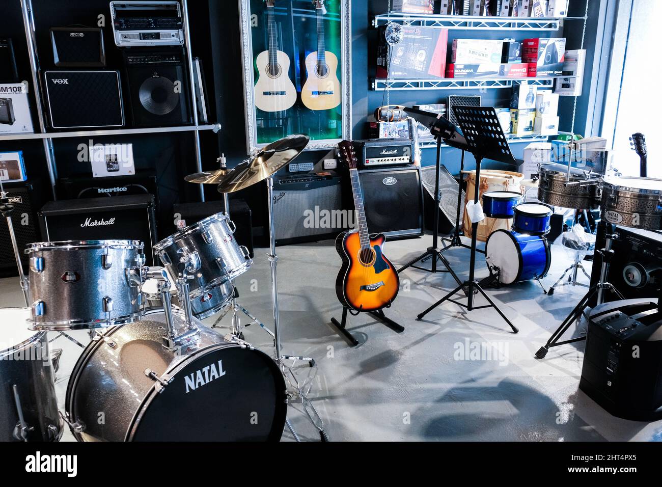 Music shop with different instruments for sale Stock Photo - Alamy