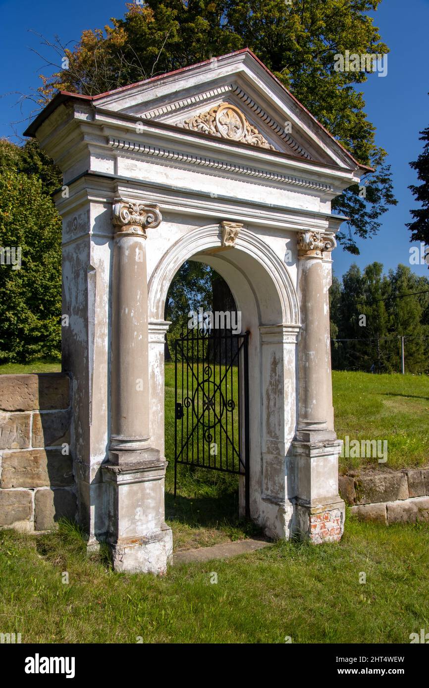 Classicist gate at the entrance to a country cemetery, Czechia Stock Photo