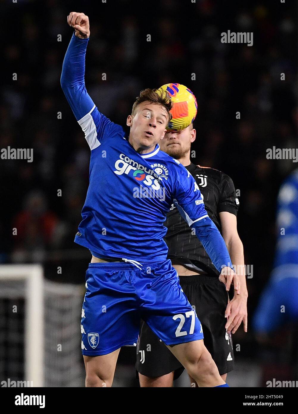 Empoli, Italy. 26th Feb, 2022. Juventus' Matthijs De Ligt (back) vies with Empoli's Szymon Zurkowski during a Serie A football match between Juventus and Empoli in Empoli, Italy, on Feb. 26, 2022. Credit: Federico Tardito/Xinhua/Alamy Live News Stock Photo