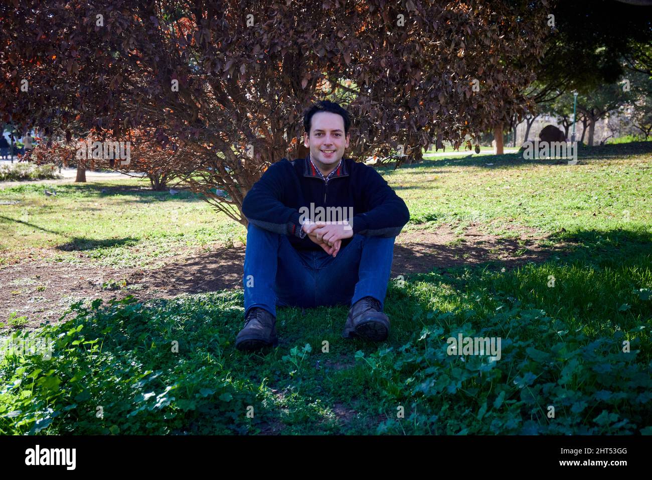 Man sitting under tree hi-res stock photography and images - Alamy