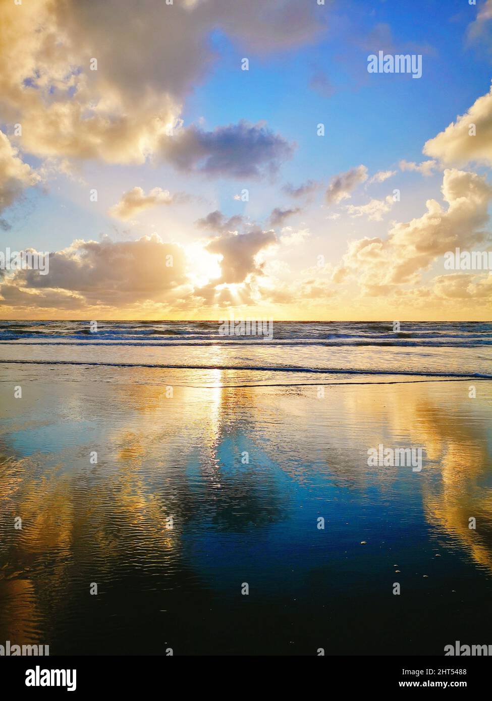 Vertical shot of the stunning sunset above the sea Stock Photo - Alamy