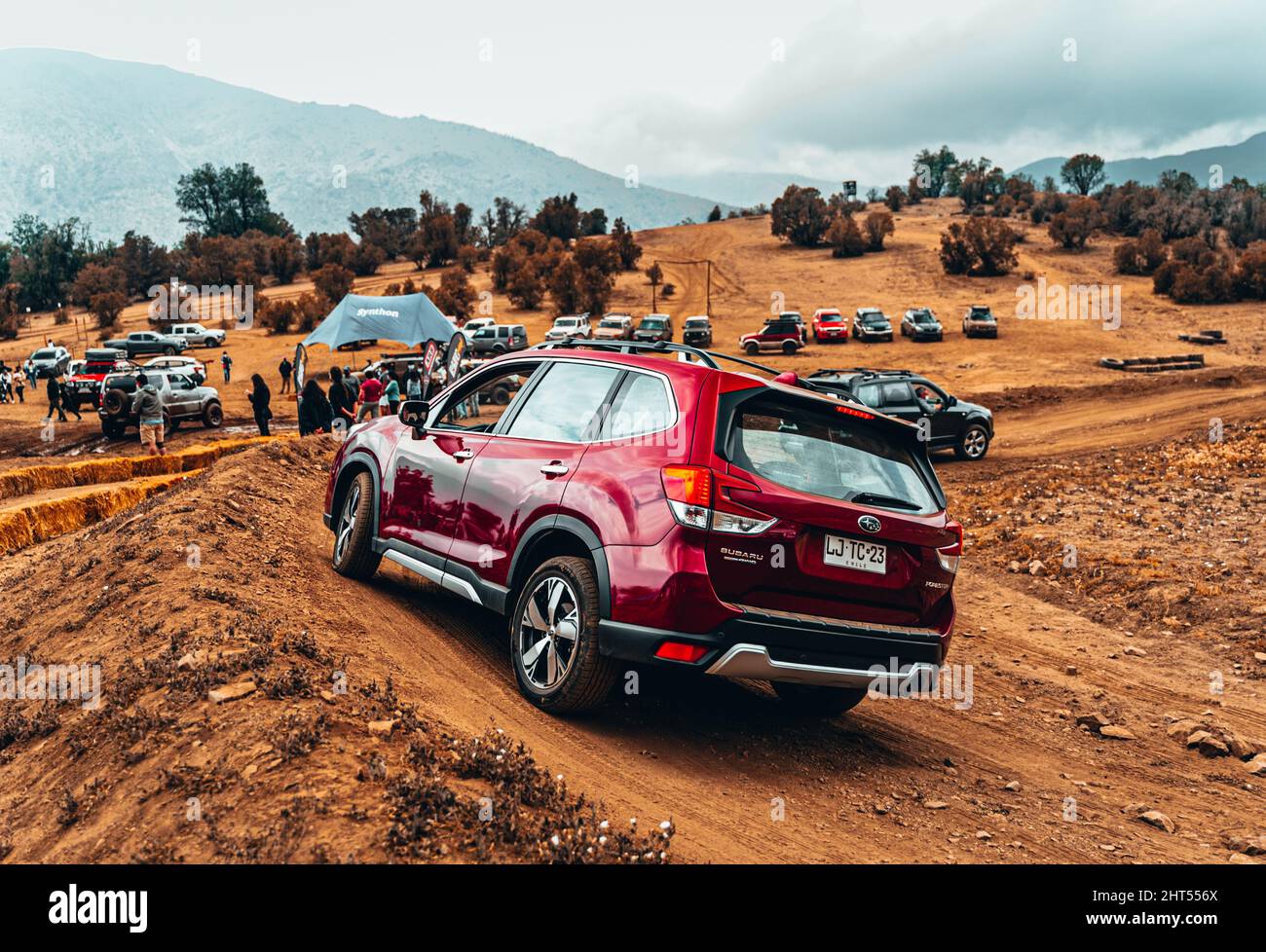 Offroad SUV vehicle passing obstacles on the ground on an offroad ...