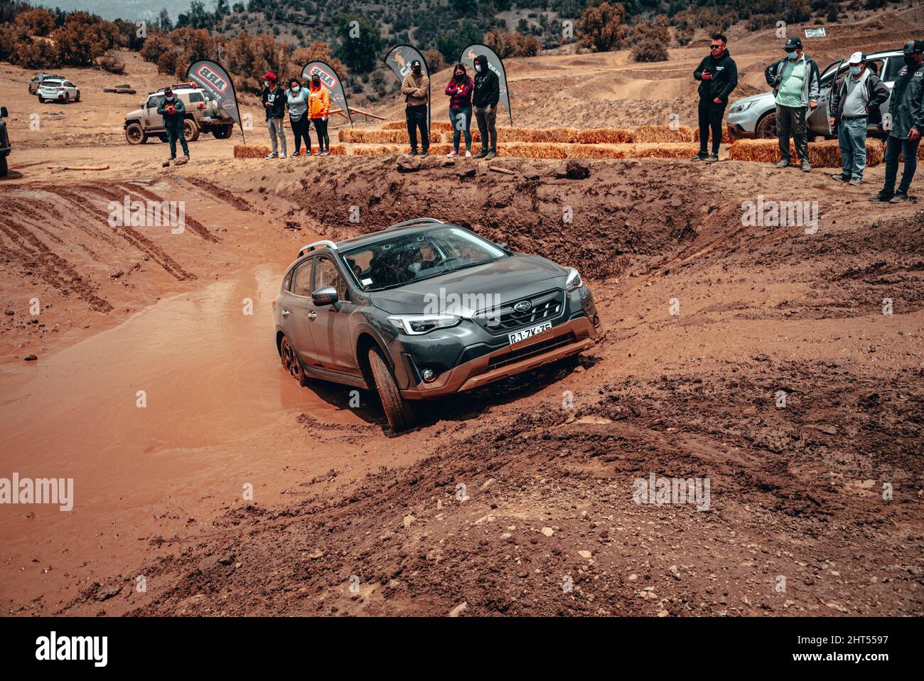 Offroad SUV vehicle passing obstacles on the ground on an offroad ...