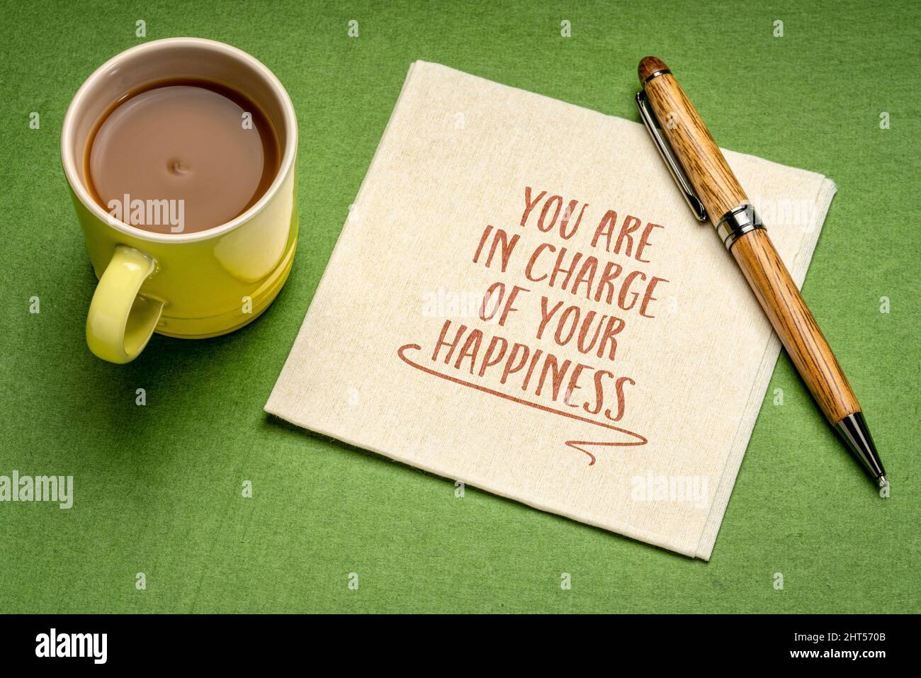 You are in charge of your happiness - inspirational reminder note on a napkin with a cup of coffee, positive mindset and personal development concept Stock Photo