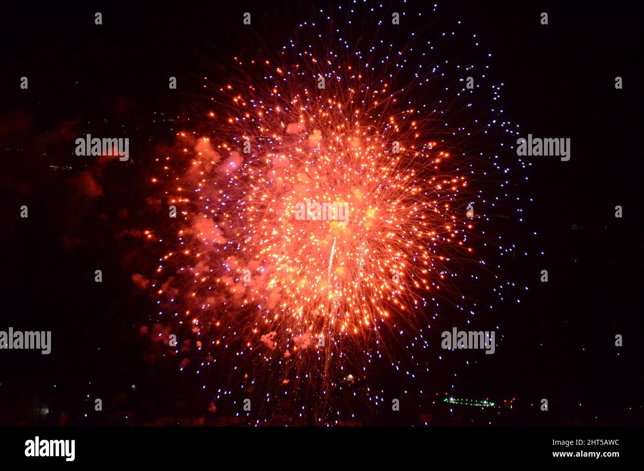 An exploding bright red light above the Gravedona in Italy Stock Photo ...