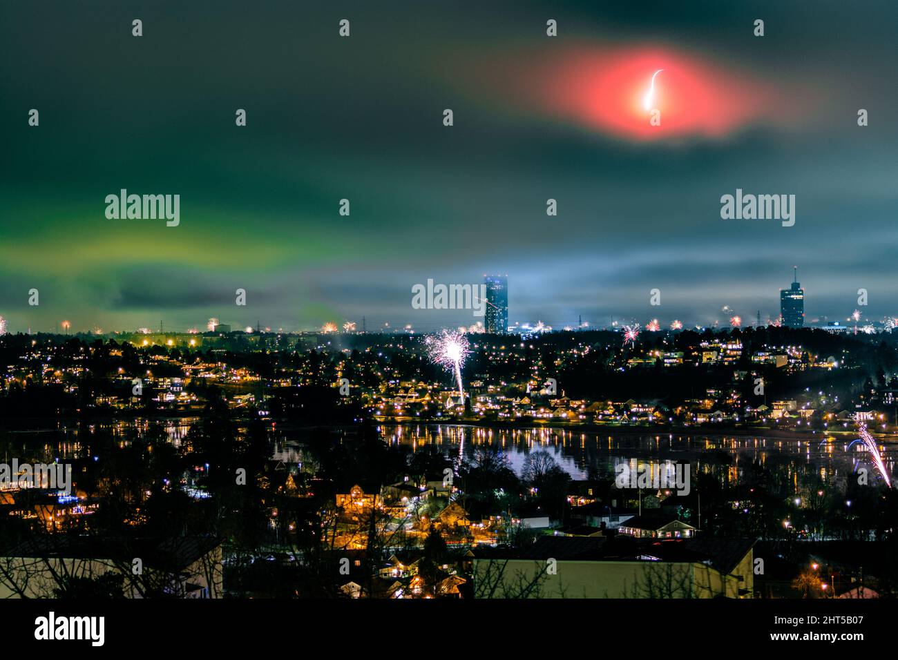 Breathtaking cityscape with fireworks and golden lights at night undear ...