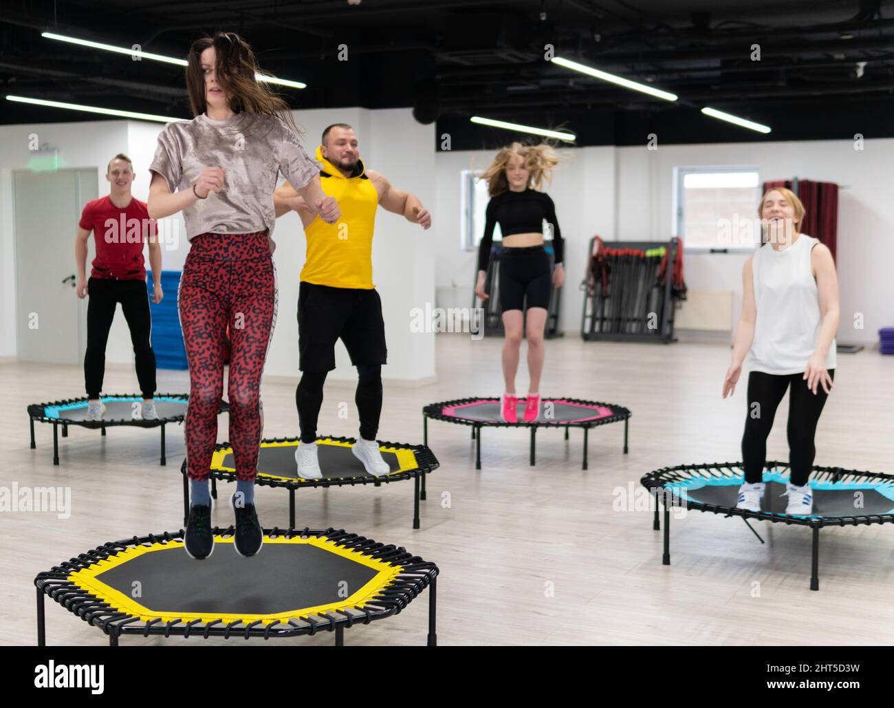 Women's and men's group on a sports trampoline, fitness training, healthy  life - a concept trampoline group batut girl health, for lifestyle activity  Stock Photo - Alamy