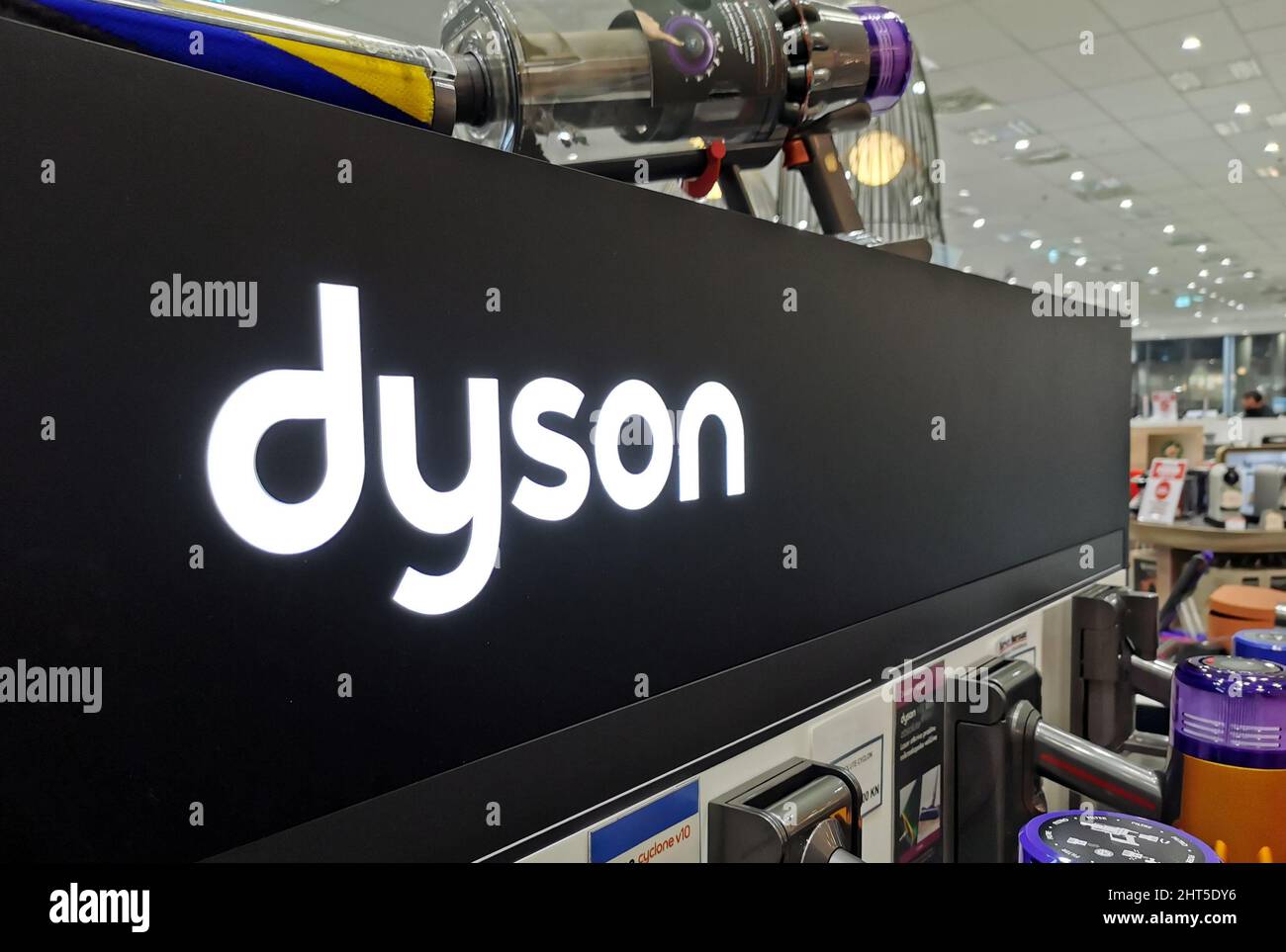 Closeup of a black sign with illuminated white Dyson logo in electronics  and home appliance store Stock Photo - Alamy