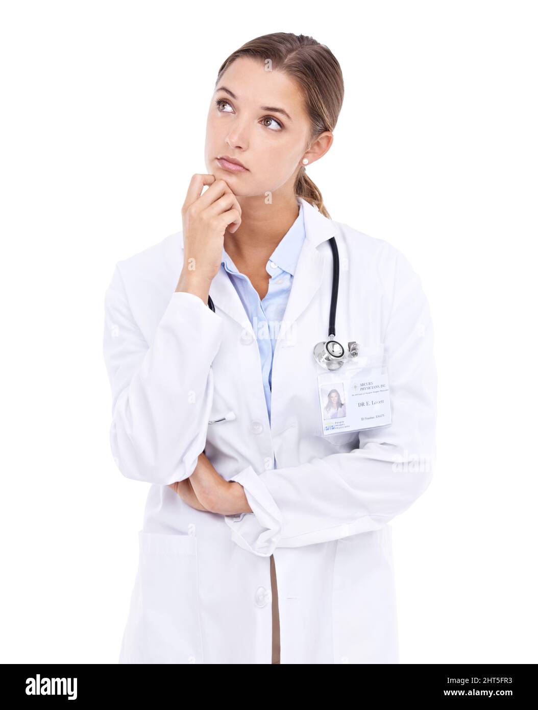 Struggling to make a concise diagnosis.... Thoughtful young female doctor isolated on white. Stock Photo