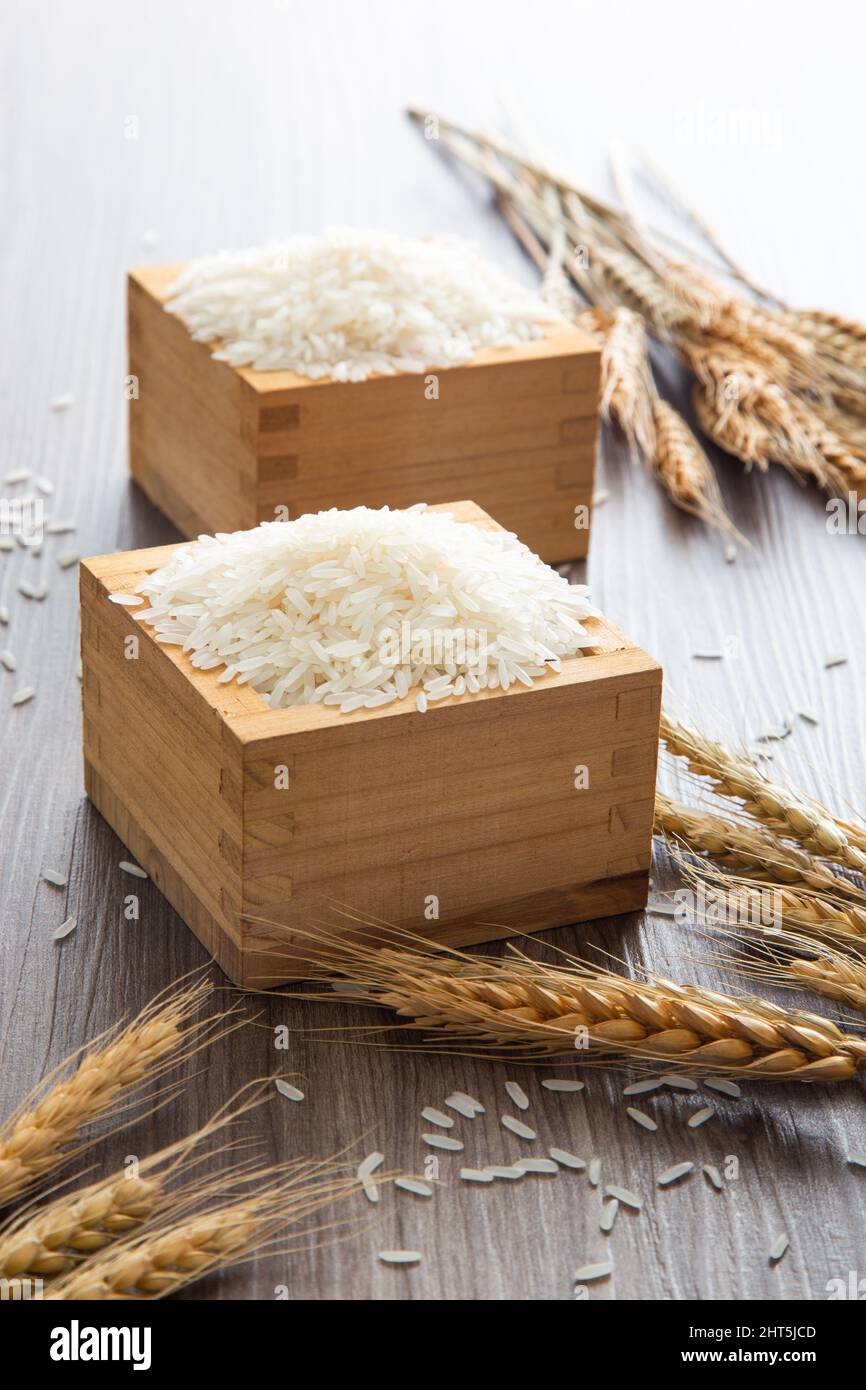 Uncooked dry Thai jasmine rice in box Stock Photo Alamy