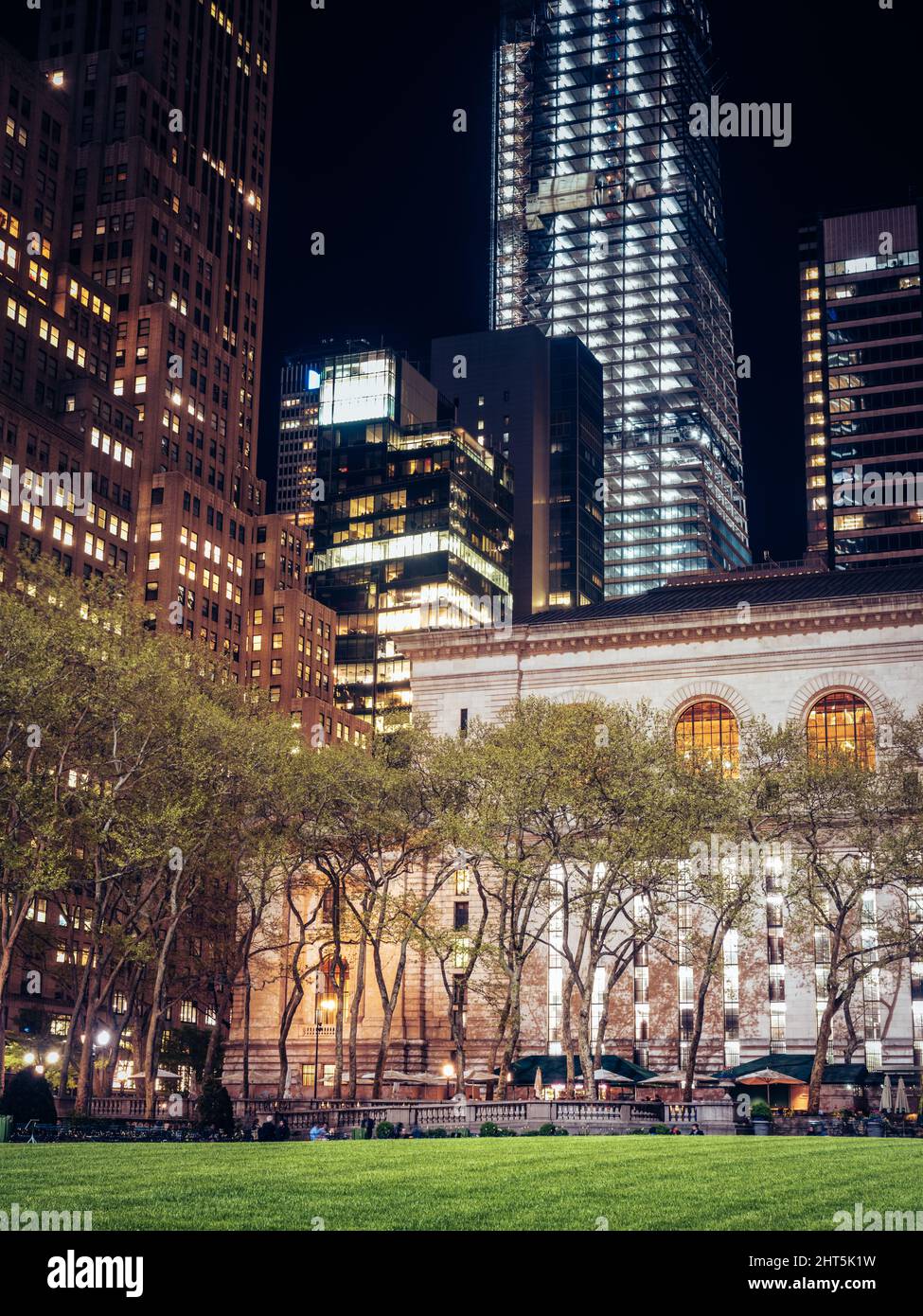 Vertical shot of beautiful buildings in New York at night Stock Photo ...