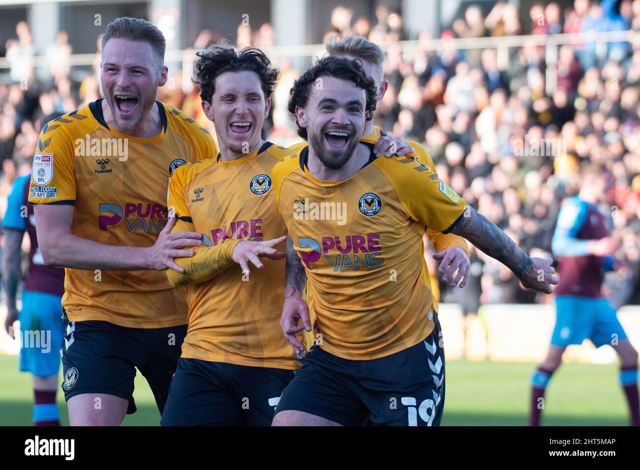 Newport, UK. 26th Feb, 2022. Dom Telford of Newport County (r) celebrates with teammates after he scores his teams 2nd goal, . EFL football league two match, Newport county v Tranmere Rovers at Rodney Parade in Newport, Wales on Saturday 26th February 2022. this image may only be used for Editorial purposes. Editorial use only, license required for commercial use. pic by Credit: Andrew Orchard sports photography/Alamy Live News Stock Photo