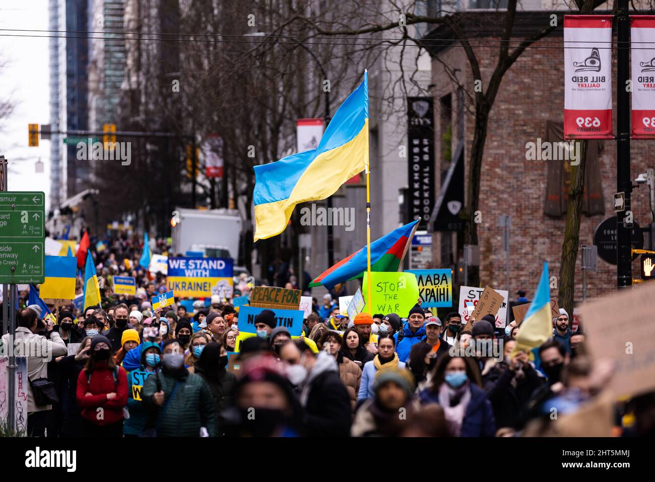 DOWNTOWN VANCOUVER, BC, CANADA - FEB 26, 2022: Protest rally against Vladimir Putin and the Russian invasion of Ukraine that was attended by thousands Stock Photo