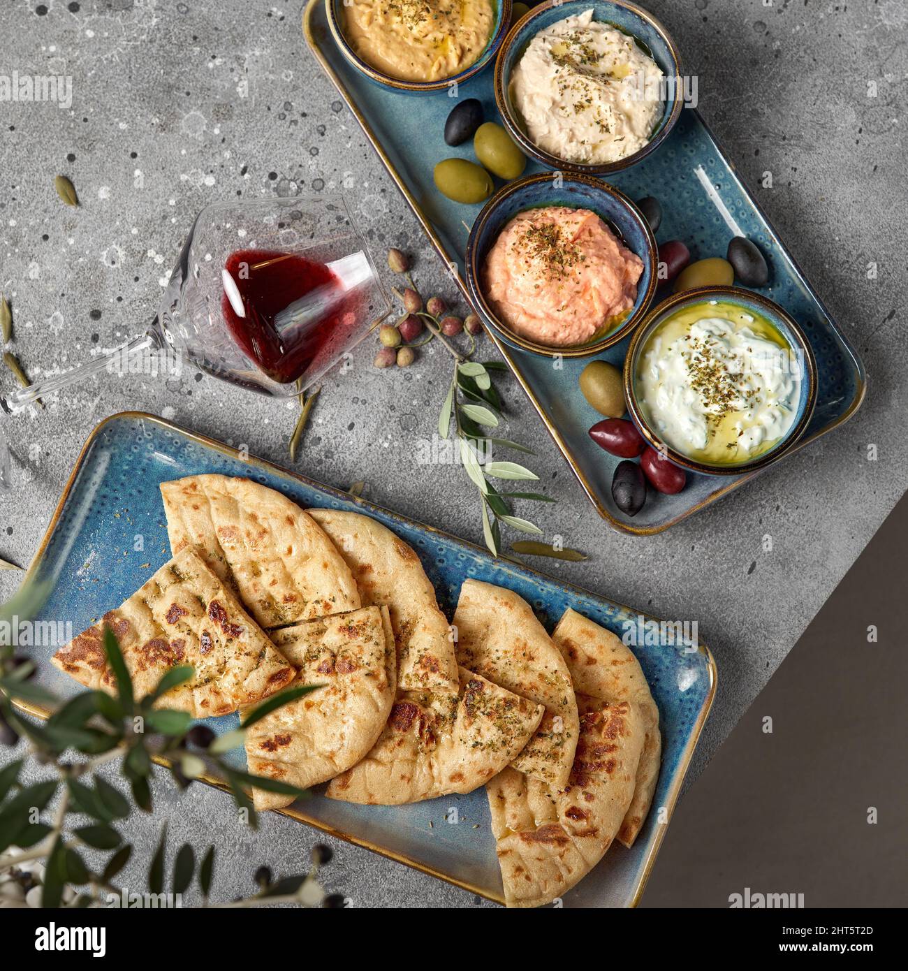 Hummus, Tzatziki served with pita bread. Greek and Mediterranean dips