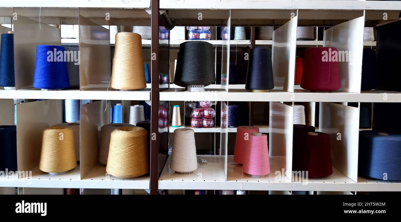 Threads of different sizes and colors stacked on the shelves Stock ...