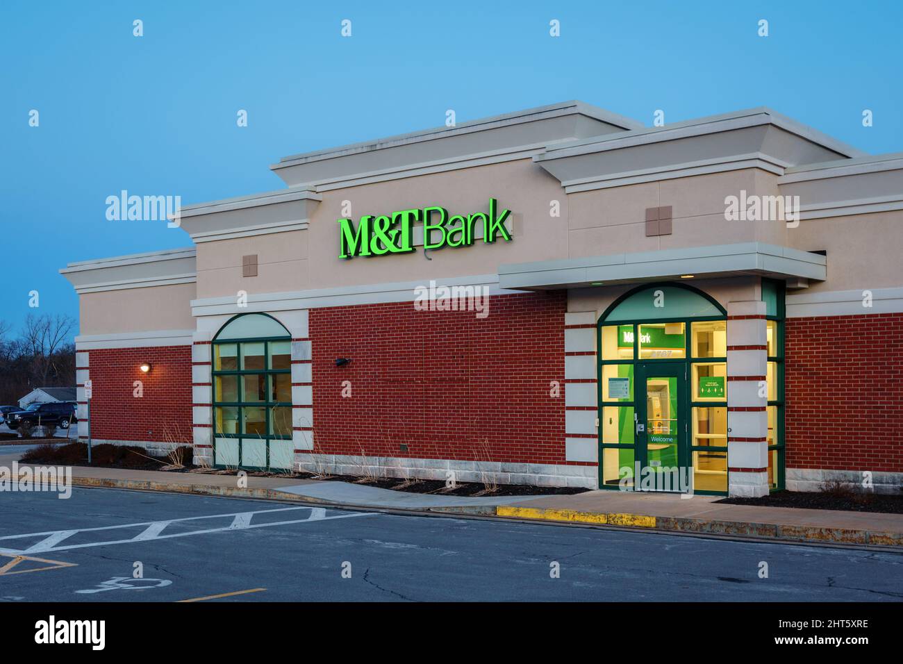 New Hartford, New York - Feb 24, 2022: Closeup Night View of M&T Bank Entrance. M&T Bank Corporation is an American bank holding co. headquartered in Stock Photo
