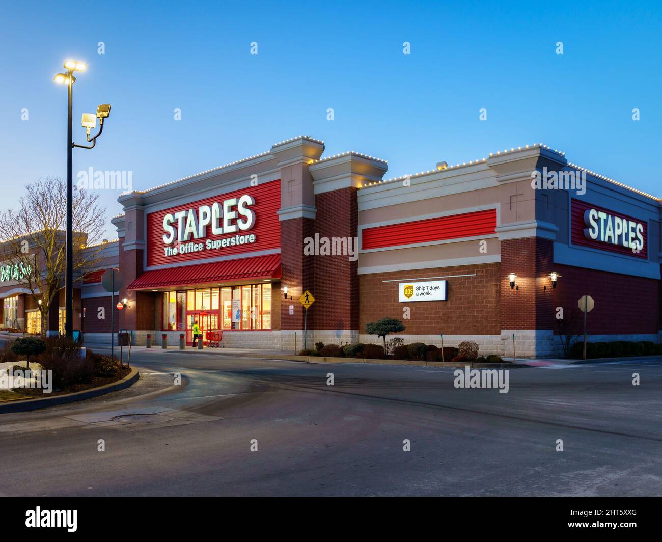 New Hartford, New York - Feb 24, 2022: Closeup Night View of Staples The Office Superstore Building Exterior. Staples Inc. is a US Office Retailer Stock Photo