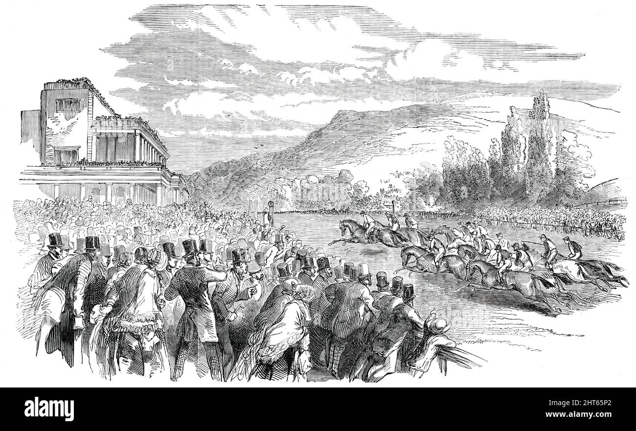 Goodwood Races, 1850. Horseracing at Goodwood Racecourse near Chichester, West Sussex. 'The Grandstand, with its saloons, banquet-halls, terraces, and parterres &quot;lying in a pleasant shade,&quot; is a fitting place wherein the noble and gentle may meet and mingle; while for the humbler holiday folk there is a splendid course for a promenade during the intervals between the races, upon which no horse man is permitted to intrude on any pretence whatever'. From &quot;Illustrated London News&quot;, 1850. Stock Photo