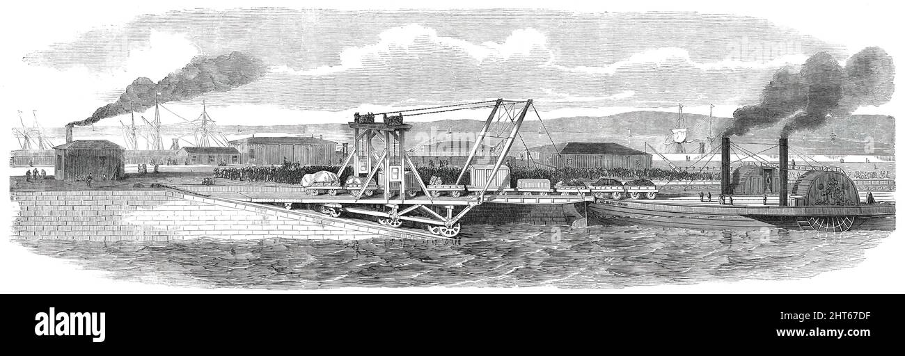 Floating Railway across the Forth, between Granton and Burntisland, [near Edinburgh, Scotland], 1850. View of the '...Leviathan, as the vessel is called...lying alongside the east side of Granton Pier, with the landing slip and apparatus for drawing off a train...upwards of twenty loaded waggons, and a passenger carriage [of the Edinburgh, Perth and Dundee Railway]...were ferried across the Forth...this mode of crossing...without changing carriages...is expected to render this the most agreeable route to and from the north of Scotland. Goods, minerals [passengers], and livestock will new be co Stock Photo