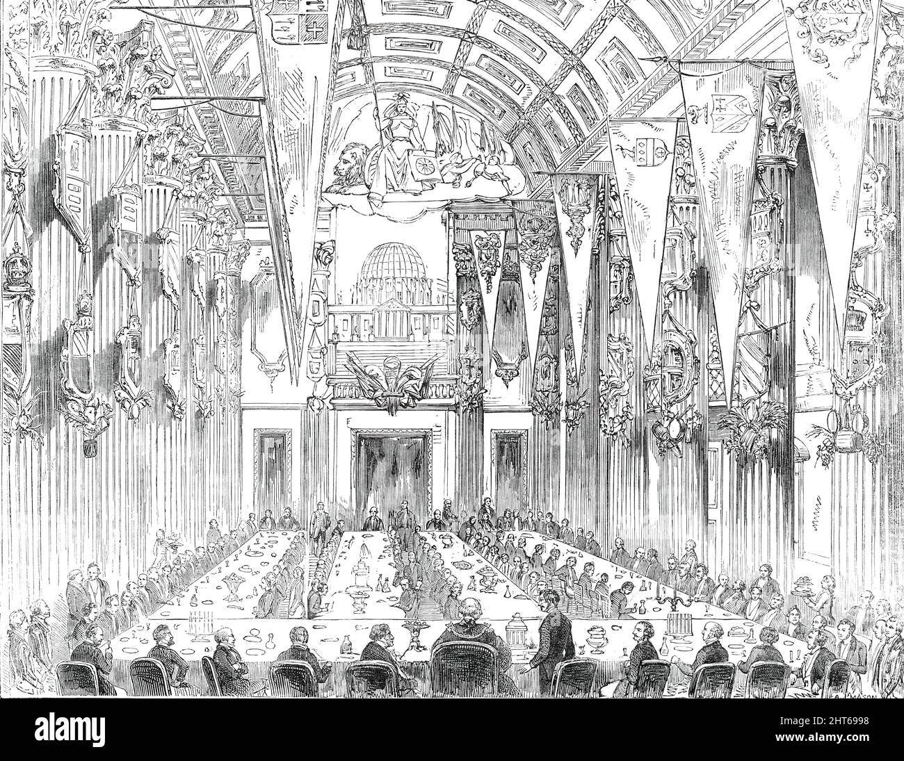 Banquet in the Egyptian Hall, at the Mansion-House, 1850. Dinner celebrating plans for the Great Exhibition of 1851: 'the Prince Consort taking the seat of honour on the right of the Lord Mayor...the hall presented an extremely brilliant and gay aspect. The tables were loaded with a profusion of plate, costly vases, fruit, and rare exotics, many beautiful emblematical devices of art, trade, and manufactures being interspersed with more substantial viands. The pillars surrounding the hall were hung with banners bearing the arms of the several counties of England, Scotland, and Wales, and at eit Stock Photo