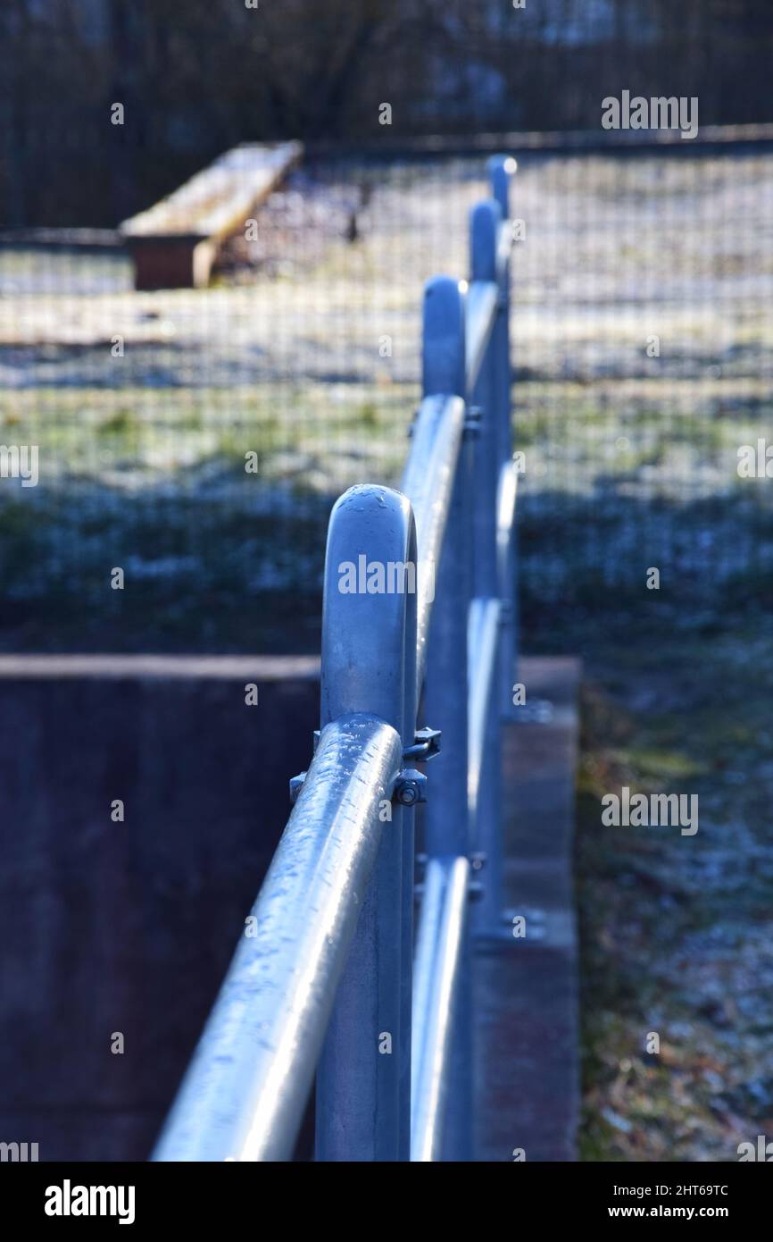 Vertical shot of a shiny metal fence Stock Photo - Alamy