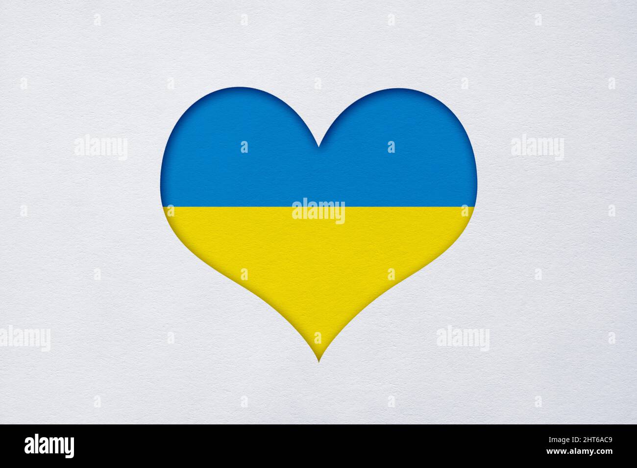 Paper cut Ukraine flag in the shape of the heart with copy space Stock Photo