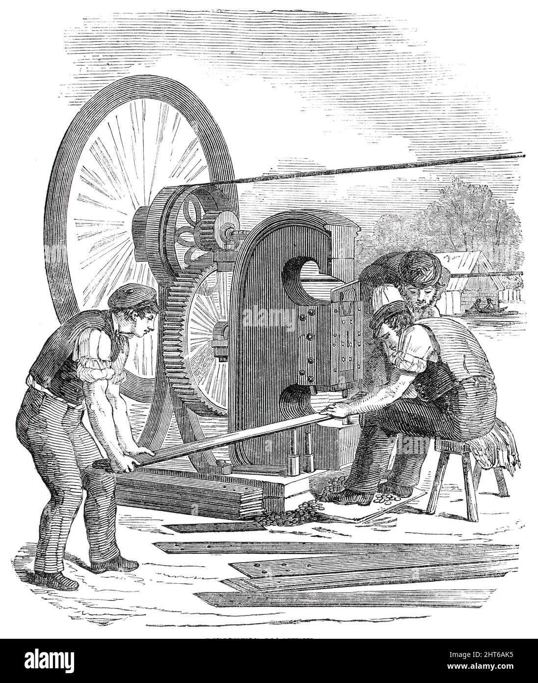 The Building in Hyde Park, for the Great Exhibition of 1851 - Punching Machine, 1850. View of '...the operations of punching bolt-holes in the bars of iron, and cutting off the ends by the shears. These modes of substituting mechanical for manual labour are to be seen in every large mechanical establishment in the kingdom. It may be mentioned here, that about 3000 holes are punched during the present working day of ten hours'. From &quot;Illustrated London News&quot;, 1850. Stock Photo