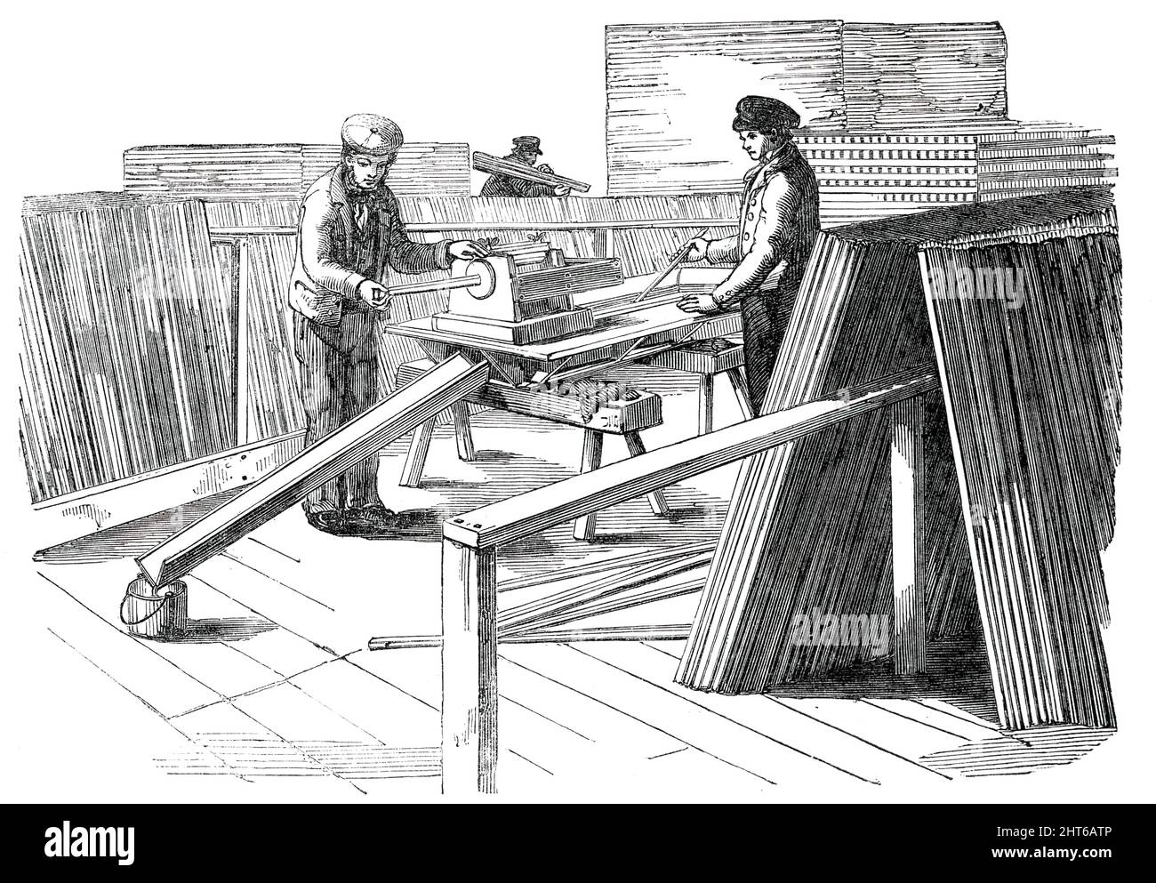 The Great Exhibition Building in Hyde Park - Painting Machine, 1850. View of '...the sash-bar painting apparatus...One of the sash-bars is occasionally passed between the brushes, to keep them clean. After being primed, it is placed in a wooden tank, containing paint of the consistence suitable for the first coat, and subsequently taken out and passed through the brushes, to remove the superfluous paint, which runs off into a wooden shute placed in an inclined position. Any of our readers who have watched the tedious process of hand-painting sash-bars, will be able to estimate the advantage of Stock Photo