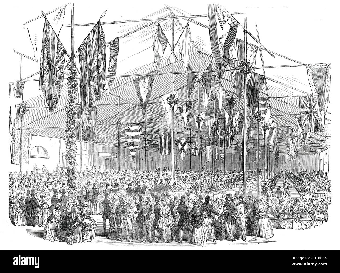 Entertainment to the Non-Commissioned Officers and Privates of the Coldstream Guards, at the Portman-Street Barracks, 1850. British soldiers and their families at an event in London '...to celebrate the two hundredth anniversary of the enrolment of that distinguished corps by the gallant and celebrated General Monck...The men having sat down, grace was said by Sergeant-Major Hurle, who presided. His Royal Highness the Duke of Cambridge occupied a seat amongst the privates. The fare consisted of about 1400 lb. of beef, with a liberal supply of pudding and beer...The Sergeant, in eloquent terms, Stock Photo