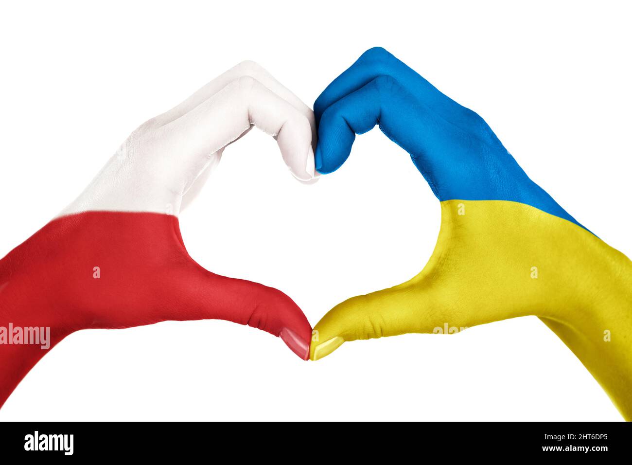 Human hands, painted in the Poland and Ukraine flags,  forming heart shape isolated on white background Stock Photo