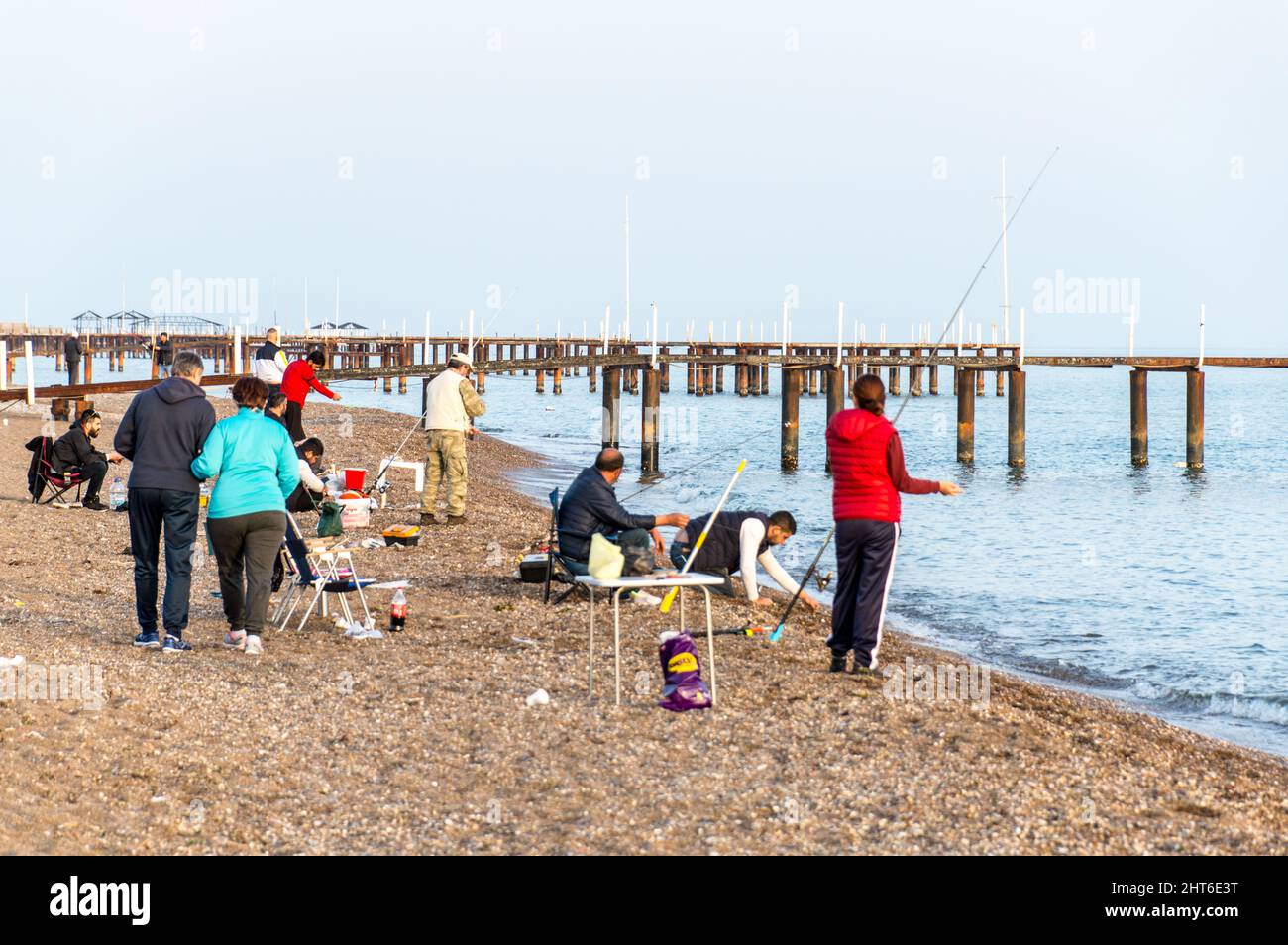 Surf fishing using anglers on a calm beach Stock Photo Alamy