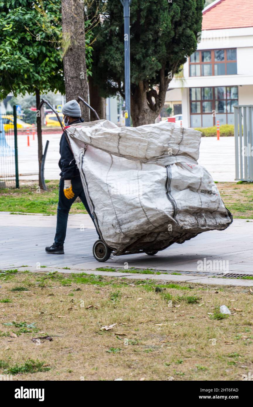 Waste collection with a huge bag on wheels in Antalya Stock Photo
