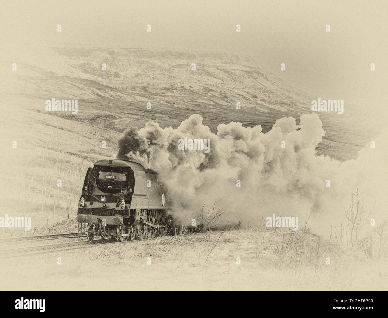 The image is of the Southern Railways Battle of Britain Class 4-6-2 #34067 Tangmere approaching Ais Gill summit on the Settle to Carlisle line in the Stock Photo
